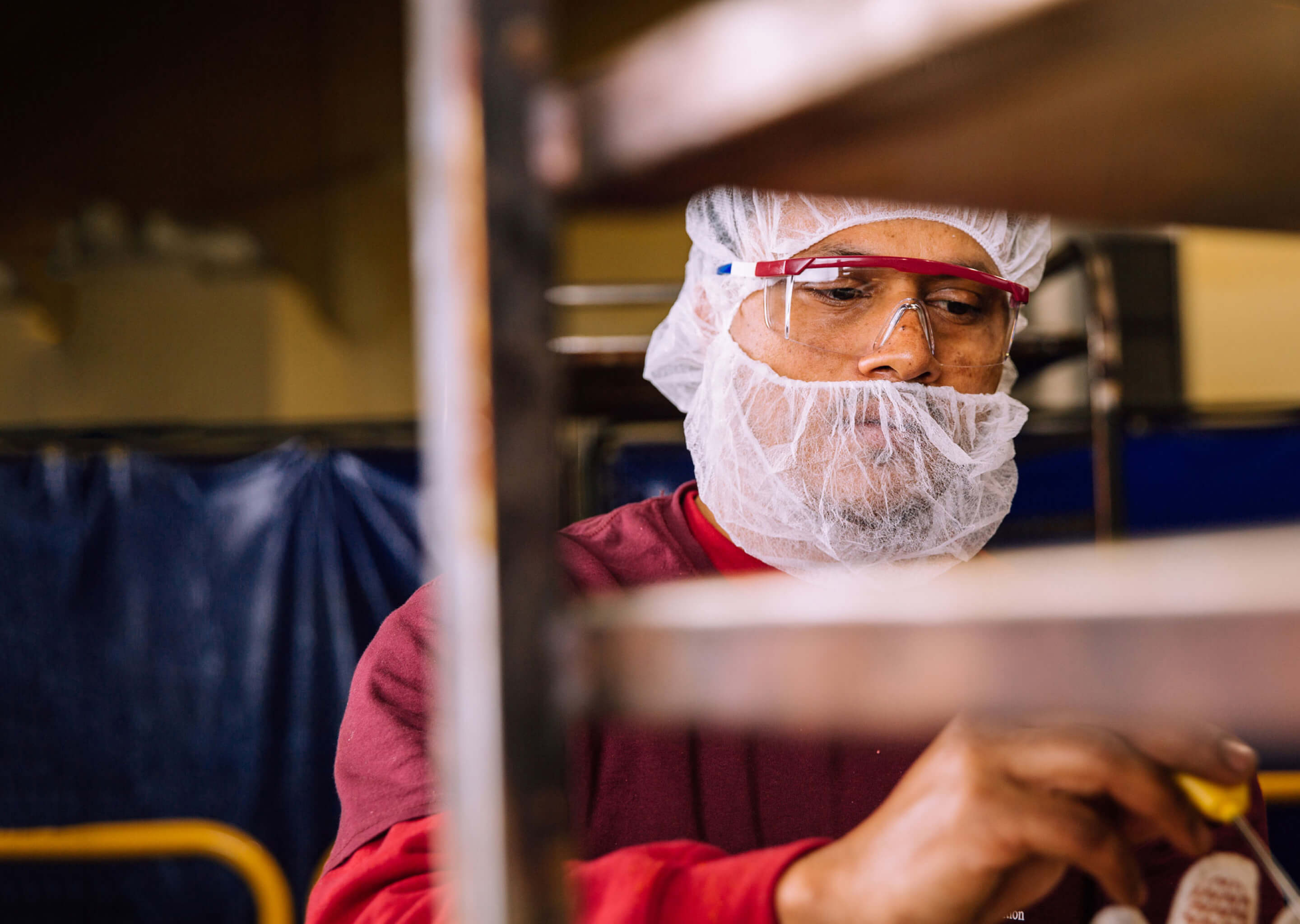 A Boston Baking employee working on a run of product for a production partner